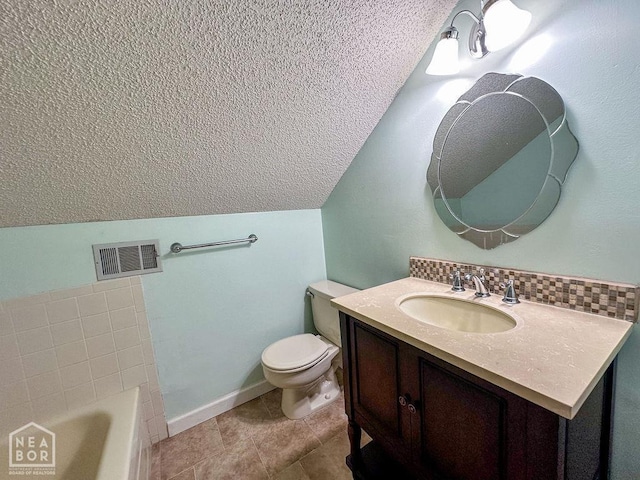 3013 Park Hill Blvd, Jonesboro, AR 72404 - bathroom with lofted ceiling, a textured ceiling, a tub, vanity, and toilet