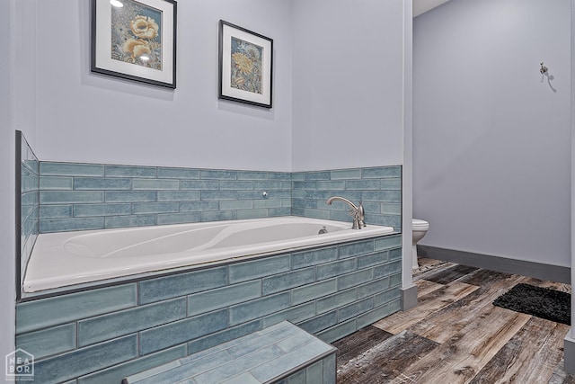 8203 Oak Creek Ln, Harrisburg, AR 72432 - bathroom with a garden tub and wood finished floors