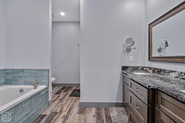 8203 Oak Creek Ln, Harrisburg, AR 72432 - full bathroom with a bath, vanity, and wood finished floors