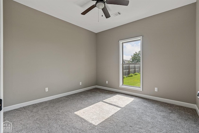 506 S Edmonds St, Monette, AR 72447 - empty room featuring carpet floors, plenty of natural light, ceiling fan, and baseboards