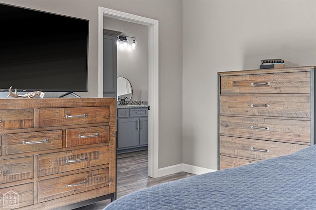 506 S Edmonds St, Monette, AR 72447 - bedroom featuring wood finished floors and baseboards