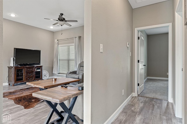 506 S Edmonds St, Monette, AR 72447 - living area with wood finished floors, a ceiling fan, and baseboards