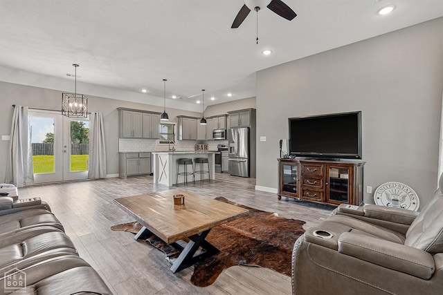 506 S Edmonds St, Monette, AR 72447 - living room featuring ceiling fan, light wood-style flooring, recessed lighting, baseboards, and french doors