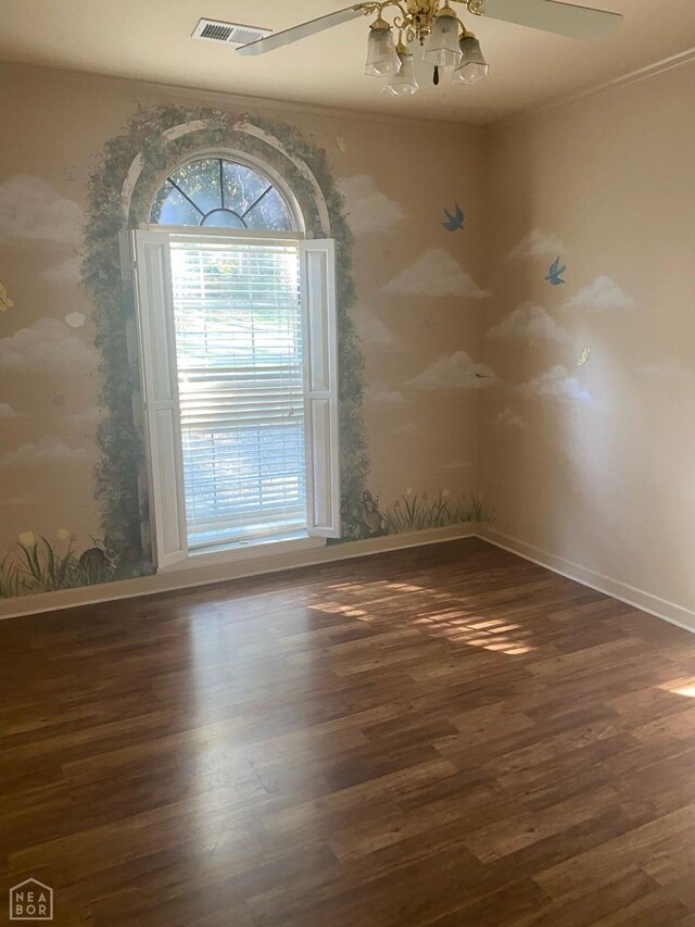 2604 Michael Ln, Jonesboro, AR 72404 - unfurnished room featuring visible vents, baseboards, a notable chandelier, ornamental molding, and wood finished floors