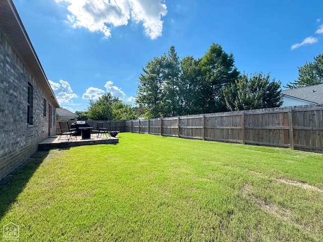 305 Stella Dr, Bono, AR 72416 - fenced backyard with a patio