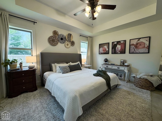 305 Stella Dr, Bono, AR 72416 - bedroom with carpet flooring, ceiling fan, and a tray ceiling