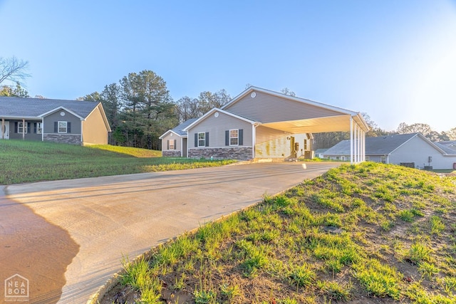 2516 Rebecca Dr, Pocahontas, AR 72455 - ranch-style house featuring stone siding, concrete driveway, and a carport