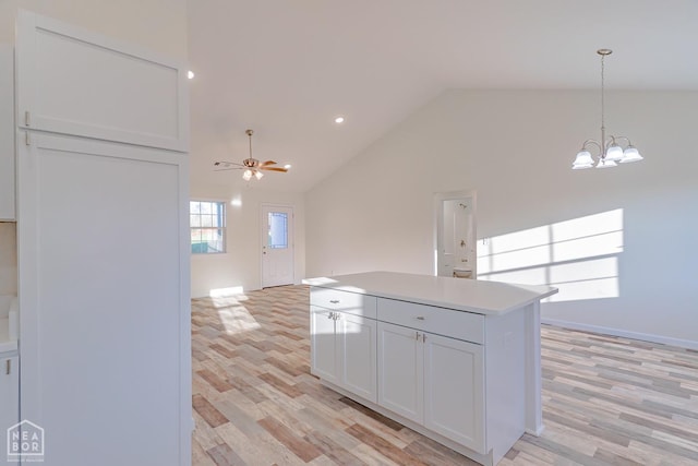 2516 Rebecca Dr, Pocahontas, AR 72455 - kitchen featuring ceiling fan, light wood-style floors, light countertops, a chandelier, and white cabinetry