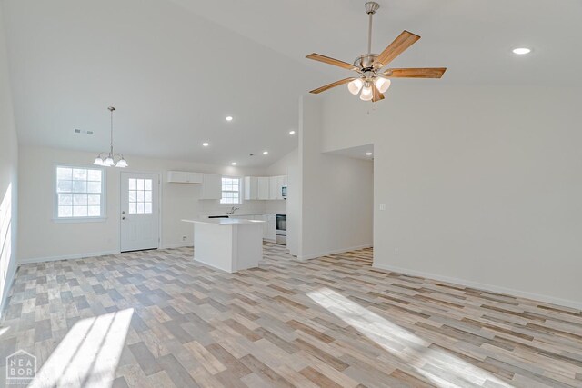 2516 Rebecca Dr, Pocahontas, AR 72455 - kitchen featuring open floor plan, white cabinets, light wood-style floors, recessed lighting, and a chandelier