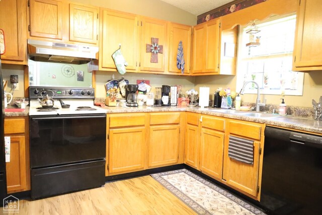 kitchen with under cabinet range hood, a sink, light wood finished floors, electric stove, and black dishwasher