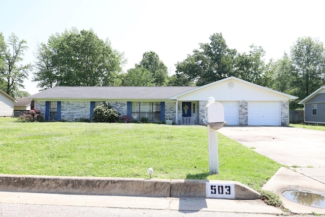 single story home featuring a garage, concrete driveway, a front lawn, and stone siding