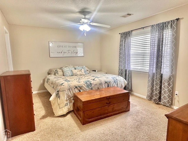 4907 Stidham Ln, Paragould, AR 72450 - bedroom with carpet flooring, ceiling fan, and a textured ceiling
