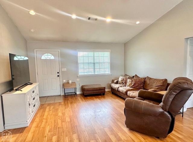 4907 Stidham Ln, Paragould, AR 72450 - living room featuring vaulted ceiling, light wood-style flooring, and recessed lighting