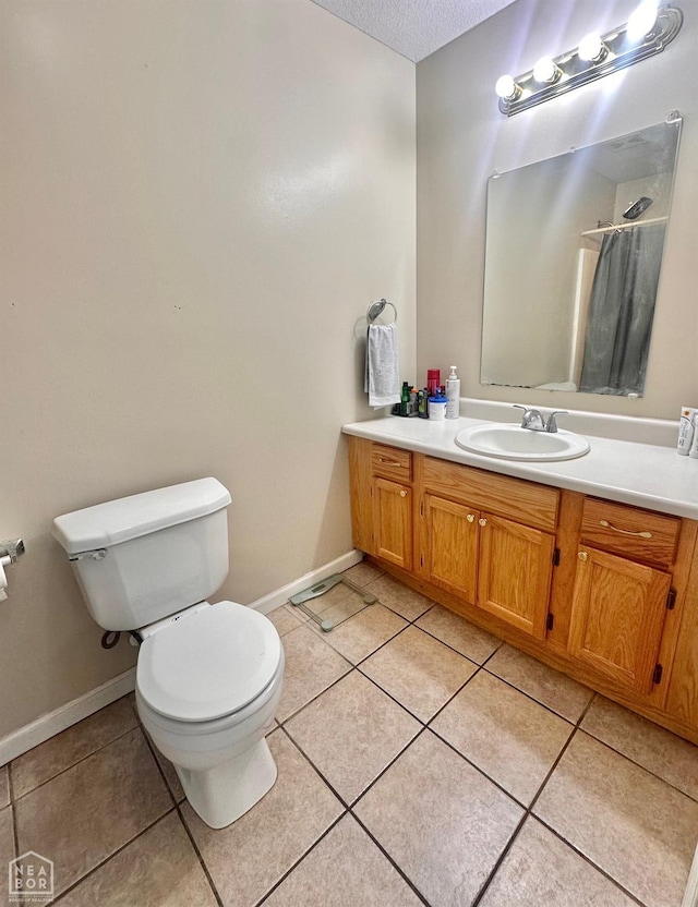 4907 Stidham Ln, Paragould, AR 72450 - bathroom featuring vanity, tile patterned flooring, and a textured ceiling