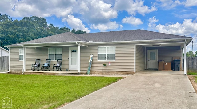 4907 Stidham Ln, Paragould, AR 72450 - view of front of home featuring a porch, an attached carport, concrete driveway, and a shingled roof