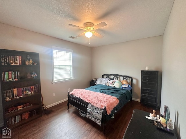 4907 Stidham Ln, Paragould, AR 72450 - bedroom featuring wood finished floors, a textured ceiling, and ceiling fan