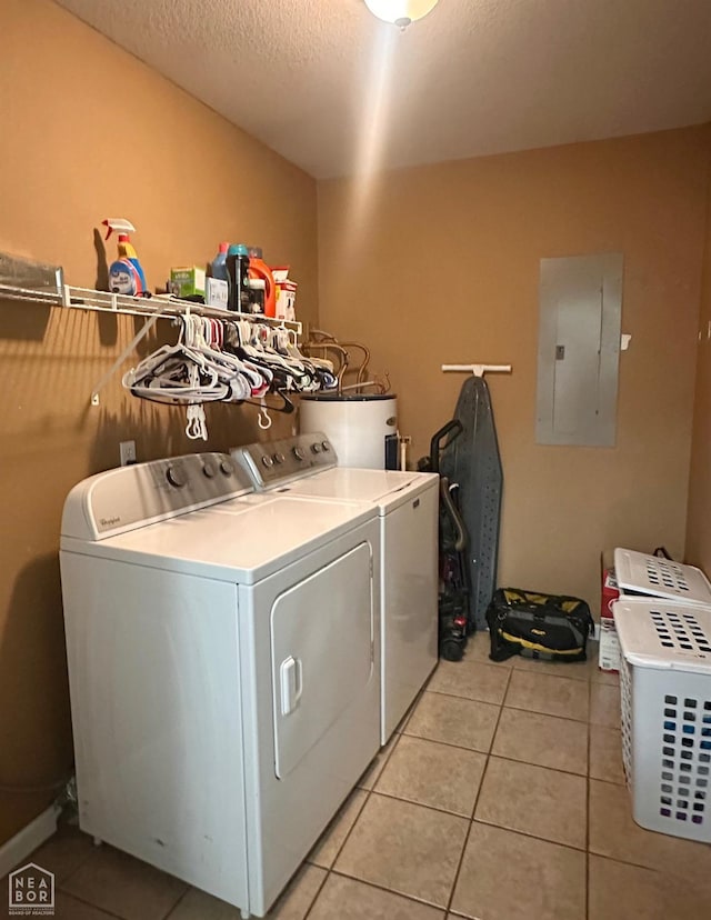 4907 Stidham Ln, Paragould, AR 72450 - washroom featuring electric panel, water heater, washer and clothes dryer, light tile patterned floors, and a textured ceiling