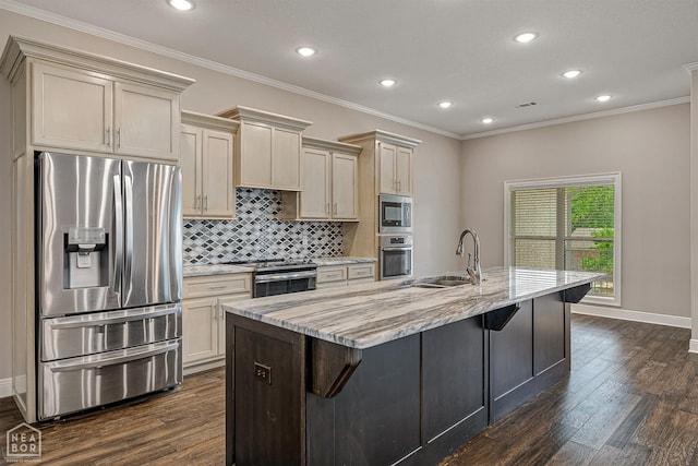 kitchen with a sink, stainless steel appliances, decorative backsplash, light stone counters, and dark wood-style floors
