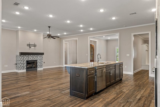 kitchen featuring stainless steel dishwasher, a ceiling fan, visible vents, and a sink