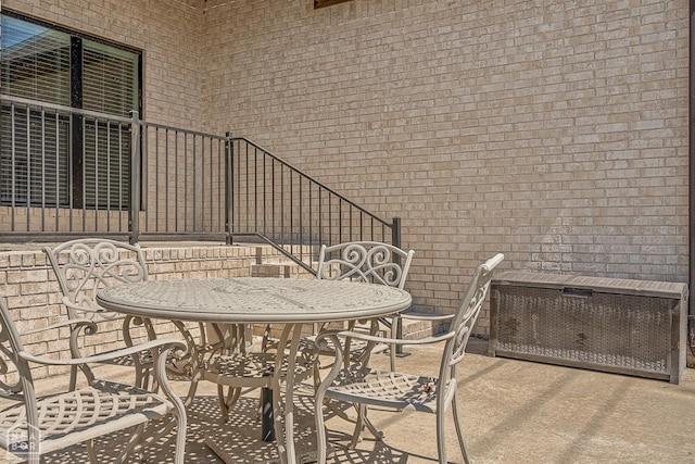 view of patio / terrace with stairway and outdoor dining area