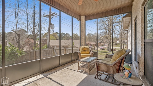 sunroom with a ceiling fan