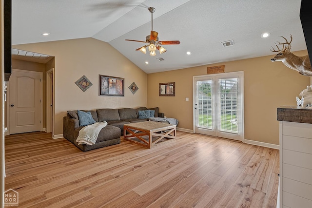 living area with a ceiling fan, baseboards, visible vents, and light wood-style floors