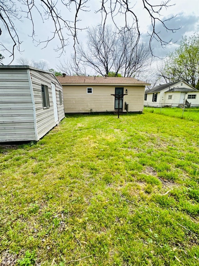 315 Arrington St, Newport, AR 72112 - view of yard featuring fence and an outbuilding