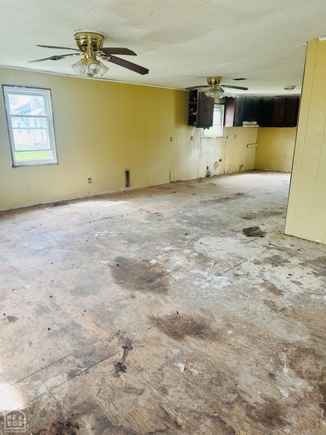 315 Arrington St, Newport, AR 72112 - spare room featuring a ceiling fan and plenty of natural light