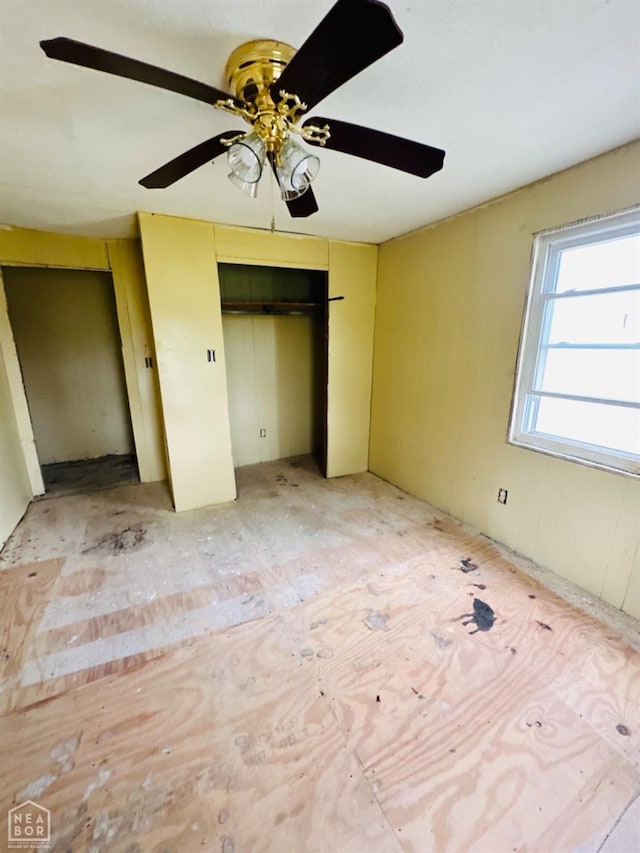 315 Arrington St, Newport, AR 72112 - unfurnished bedroom with ceiling fan and multiple closets