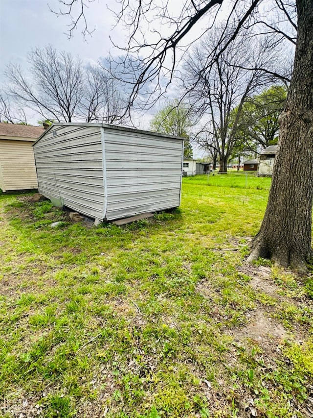 315 Arrington St, Newport, AR 72112 - view of yard with an outbuilding and a storage unit