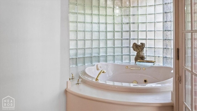 bathroom featuring a whirlpool tub
