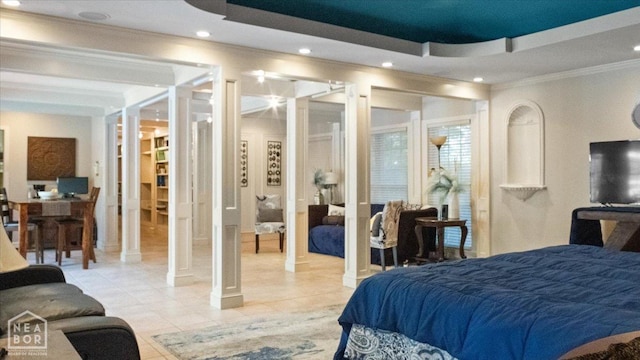 bedroom with a tray ceiling, light tile patterned floors, ornamental molding, and recessed lighting