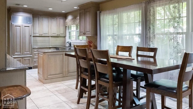 dining space featuring recessed lighting and light tile patterned flooring