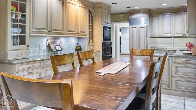 dining room featuring recessed lighting and light tile patterned floors