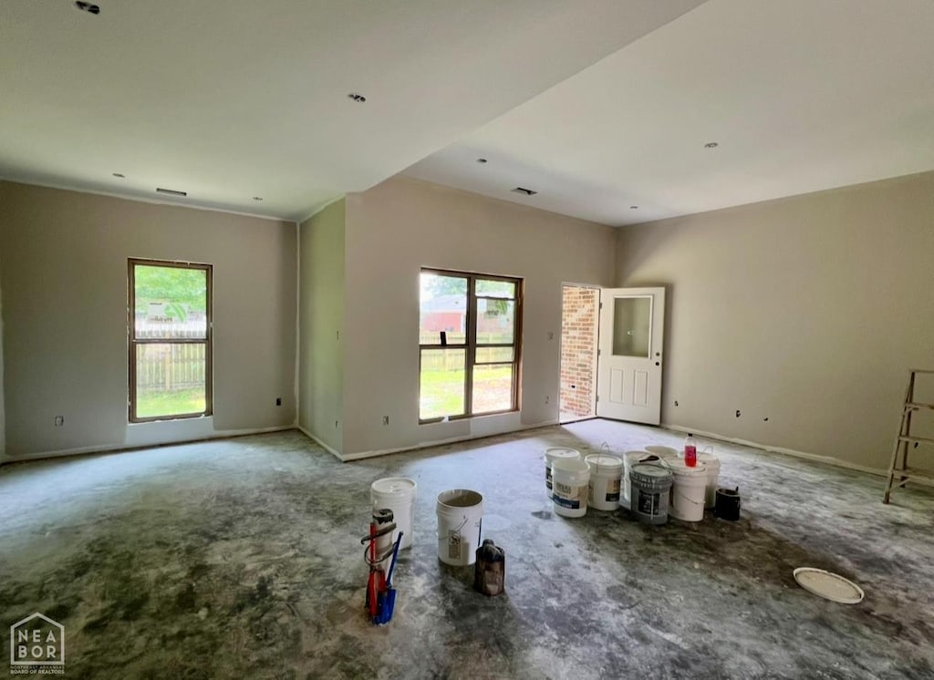 408 S Baltimore Ave, Manila, AR 72442 - unfurnished room featuring healthy amount of natural light, carpet flooring, and baseboards