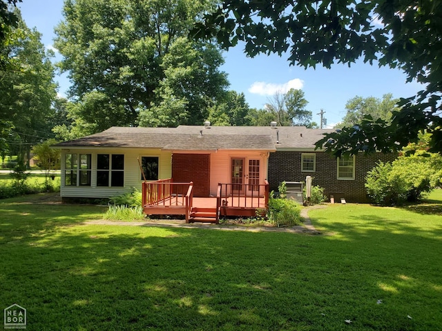 937 Homecrest Dr, Piggott, AR 72454 - rear view of property featuring a deck, a yard, and brick siding