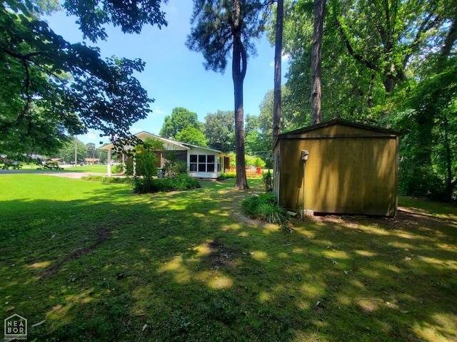 937 Homecrest Dr, Piggott, AR 72454 - view of grassy yard with a shed