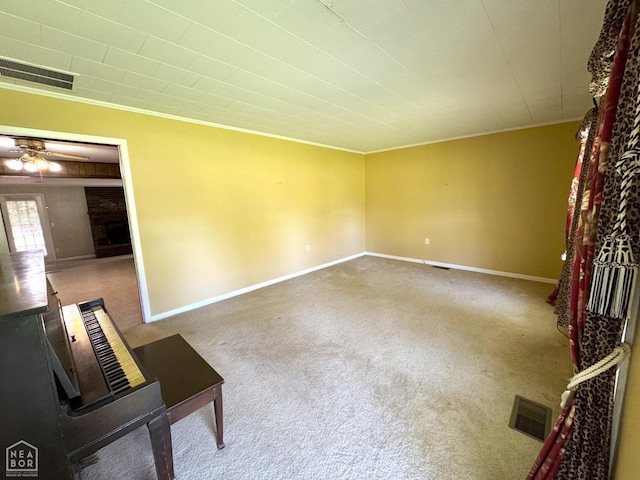 937 Homecrest Dr, Piggott, AR 72454 - unfurnished living room with carpet, crown molding, and ceiling fan