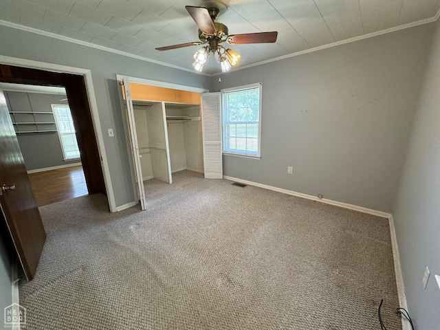 937 Homecrest Dr, Piggott, AR 72454 - unfurnished bedroom with ornamental molding, a closet, carpet floors, and a ceiling fan