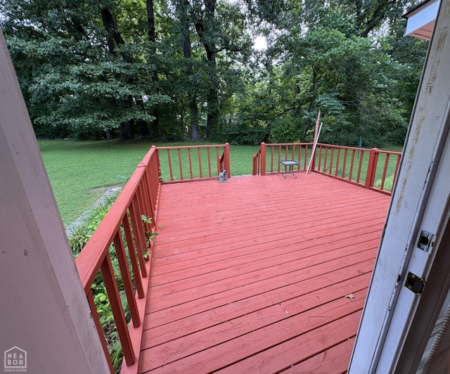 937 Homecrest Dr, Piggott, AR 72454 - wooden deck with a lawn and view of wooded area