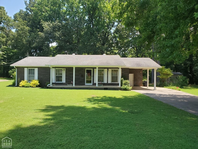 937 Homecrest Dr, Piggott, AR 72454 - ranch-style home with brick siding, a front yard, concrete driveway, and an attached carport
