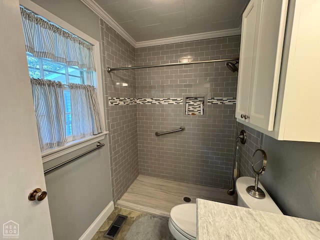 937 Homecrest Dr, Piggott, AR 72454 - bathroom with ornamental molding, tiled shower, and vanity