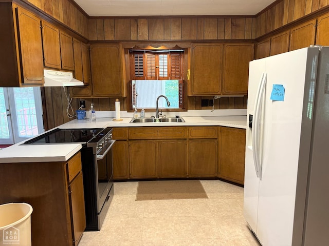 937 Homecrest Dr, Piggott, AR 72454 - kitchen featuring white fridge with ice dispenser, electric range oven, under cabinet range hood, and light countertops