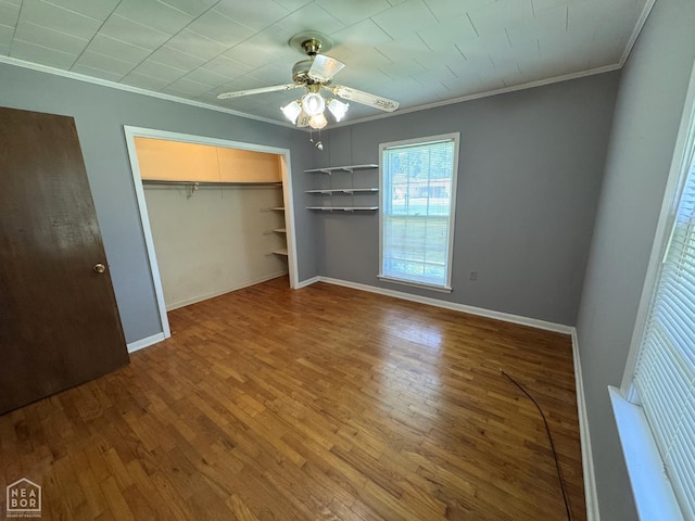 937 Homecrest Dr, Piggott, AR 72454 - unfurnished bedroom featuring ornamental molding, wood finished floors, a closet, and ceiling fan