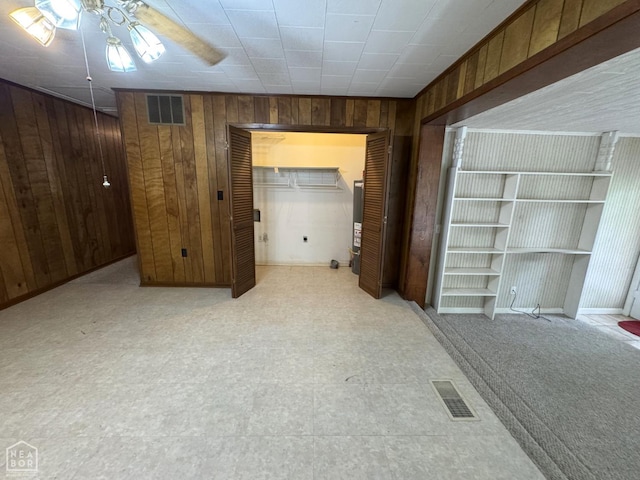 937 Homecrest Dr, Piggott, AR 72454 - interior space featuring wood walls and ceiling fan