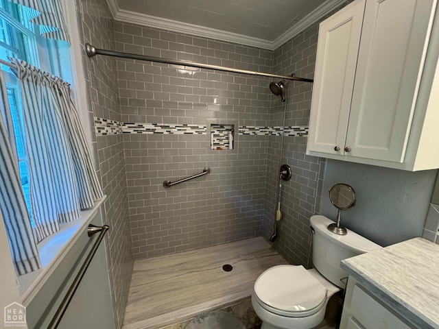 937 Homecrest Dr, Piggott, AR 72454 - bathroom with crown molding, a tile shower, and vanity