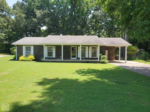 937 Homecrest Dr, Piggott, AR 72454 - single story home featuring covered porch, driveway, a carport, a front yard, and brick siding