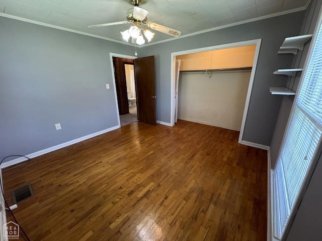 937 Homecrest Dr, Piggott, AR 72454 - unfurnished bedroom with crown molding, wood finished floors, a closet, and ceiling fan