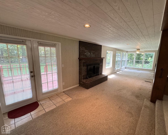 937 Homecrest Dr, Piggott, AR 72454 - unfurnished living room featuring carpet flooring, plenty of natural light, a brick fireplace, tile patterned floors, and wood ceiling