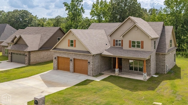 view of front of home with a shingled roof, a garage, a front yard, and driveway